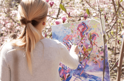 a woman painting flowers