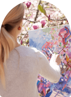 a woman painting flowers