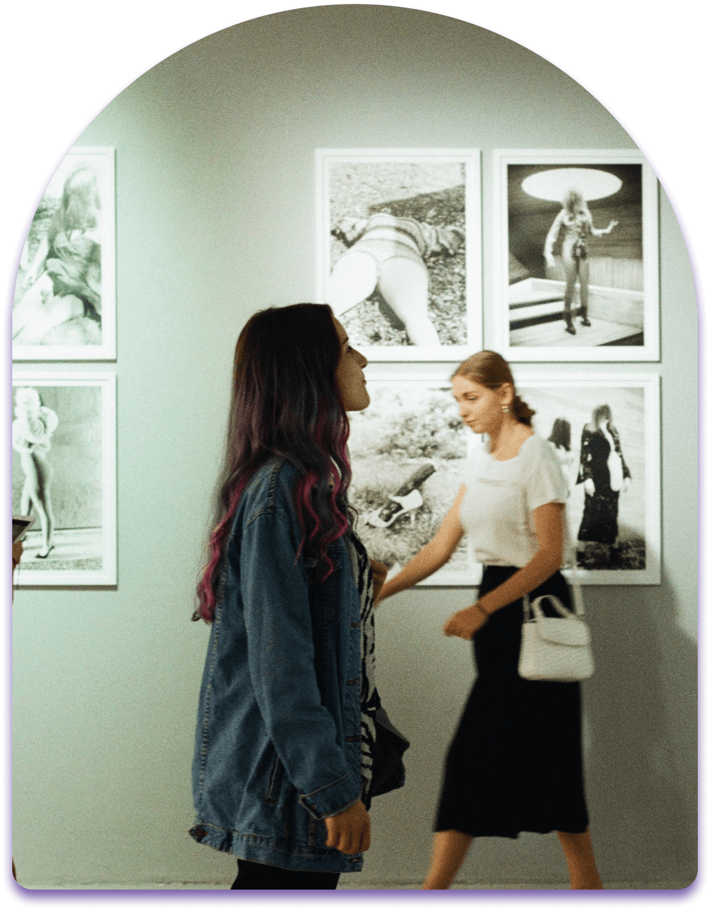 visitors of art show looking at artwork